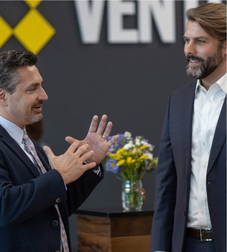Professional networking and collaboration in a modern workspace environment. Focused on fostering community and productivity for entrepreneurs and remote teams.